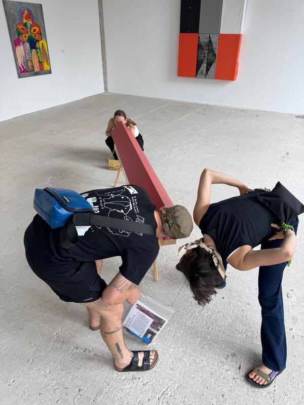 untitled birdhouse project with its feet and paint as shown for Hochschule für Gestaltung Offenbach Rundgang 2025 with viewers present